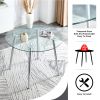 Table and chair set. (1 table+4 gray chairs) Round dining table with a 40 inch diameter glass tabletop and silver plated metal legs. 4 gray PU chairs